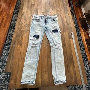 Pre-owned moderately used Empyre Distressed Jeans in blue. 33x30 size
